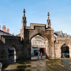 Gateway to Parish Church of St Mary and fountain to side
