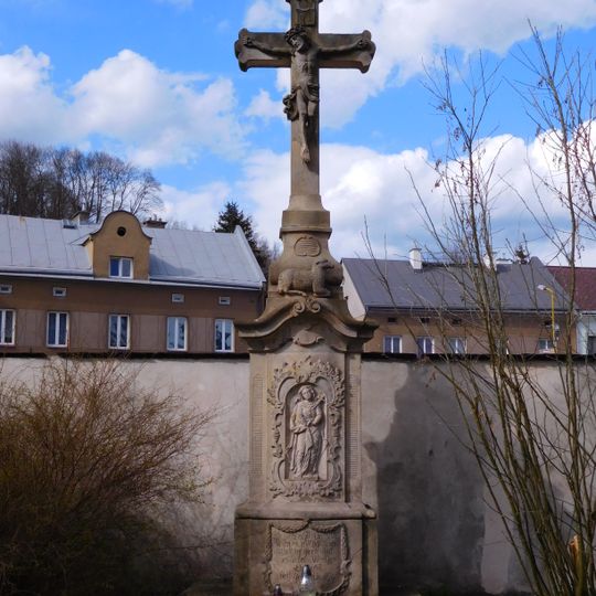 Stone cross at the Holy Trinity Church in Hostinné