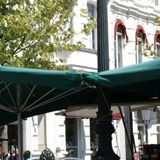 Horse drinking trough and street clock in Stationsstraat Maastricht