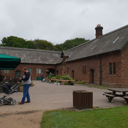 E shaped range of farm buildings to the east of Speke Hall