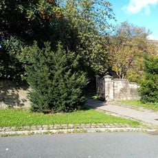 Boundary walls and gateways to west and south of Church of St John the Divine