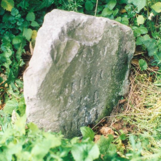 Milestone, near Oxclose Wood, S of A6 jct