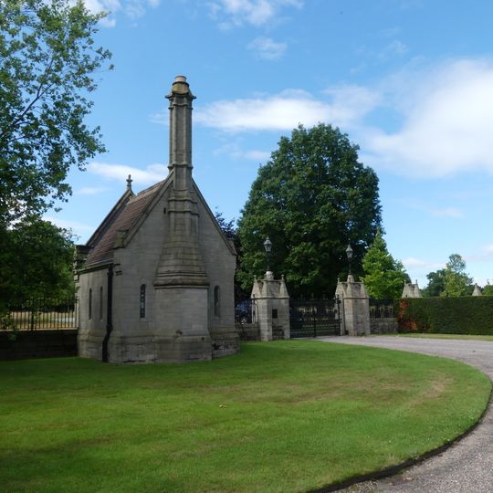 Lodge, gates, piers and screens to forecourt between Coach-House Court and Eaton Hall Cottages