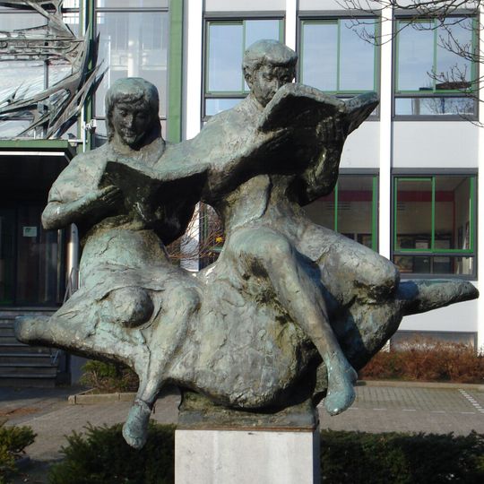 Lezende jongen en meisje