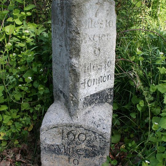 Milestone, 80m W of turn to Farlands Farm, opp. Gribble Lane