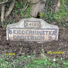 Milestone, N of Frenth Cottages, 30yds S of turning to Hampton Farm;