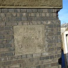 Milestone, in parapet of bridge over disused canal