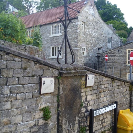 Wall incorporating C18 water supply point and a circa 1800 lamp standard