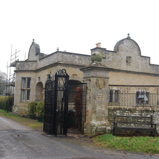 Lodge and attached wall at Stokesay Court