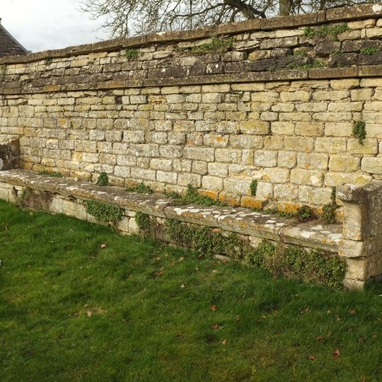 Wall Incorporating Stone Seat Forming The Northern Boundary To The Churchyard Of The Church Of St Mary
