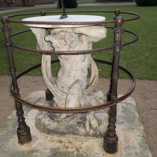 Satyr with a sundial in Łazienki Park in Warsaw