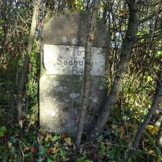 Milestone, Earthcott Green; W of jcn B4427