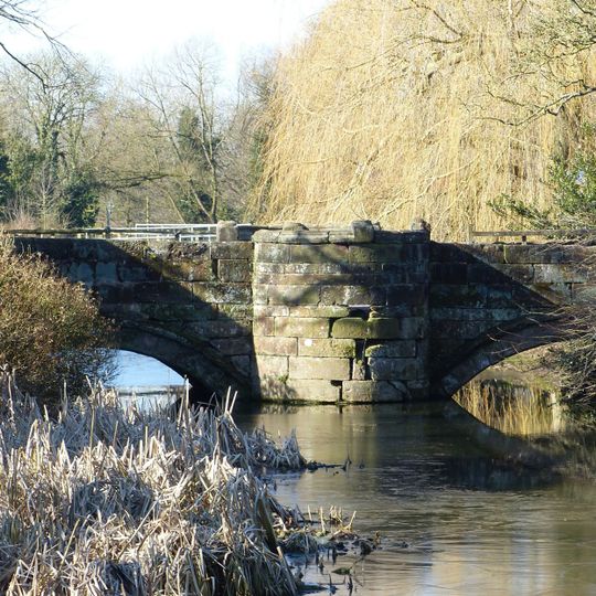 Stone bridge crossing the moat at Holford Hall