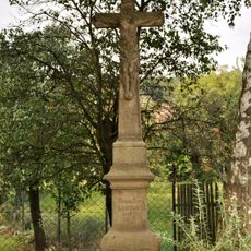 Stone wayside cross in Padochov
