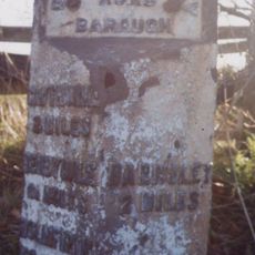 Milestone, third of a mile west of TI jct of A635/A637 (Redbrook)