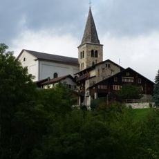 Saint-Romain church with bell tower and surroundings