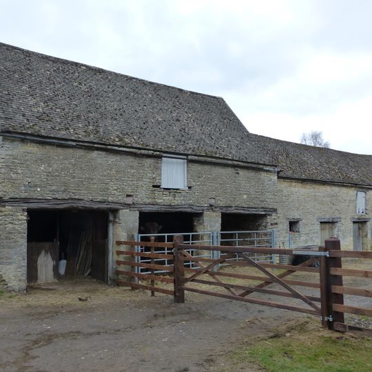 Cartshed and granary with attached cowhouse across road and to south east of Manor Farmhouse