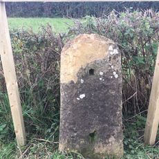 Milestone, 200m W of Woodmancote Farm (the Monkey House)