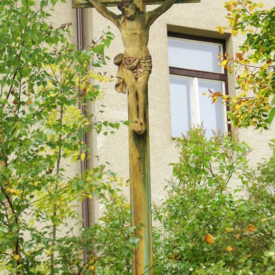 Wayside cross in front of the school