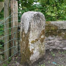 Milestone, E end of old Brent Bridge, just off B3372, nr old toll house