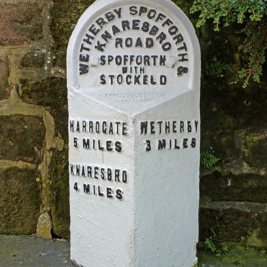 Milepost Against North Corner Of Castle Farmhouse