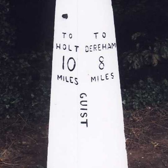 Milestone, opp. 4th house N of jct with A1067