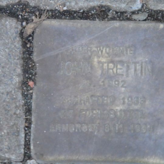 Stolperstein en memoria de John Trettin