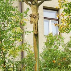 Wayside cross in front of the school