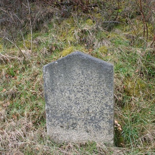 Milestone, Portgate, 50m E of Harris Arms PH