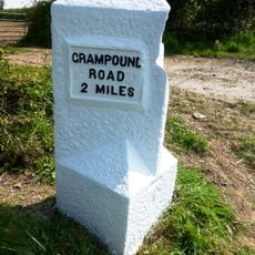 Milestone, Scarcewater, S of crossroads with A3058