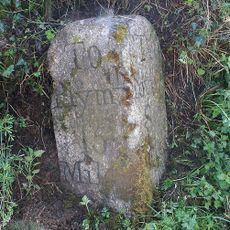 Milestone, 90m W of Hookmoor Cross, in narrow lane