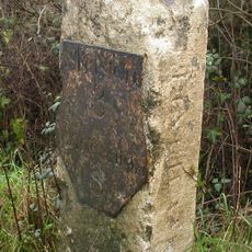 Milestone, a mile SE of Gillingham; 115m W of small lay-by.