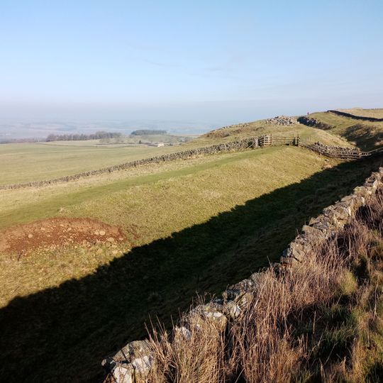 Hadrian's Wall and vallum between the road to Simonburn and the field boundary east of Carrawburgh car park in wall miles 29, 30 and 31